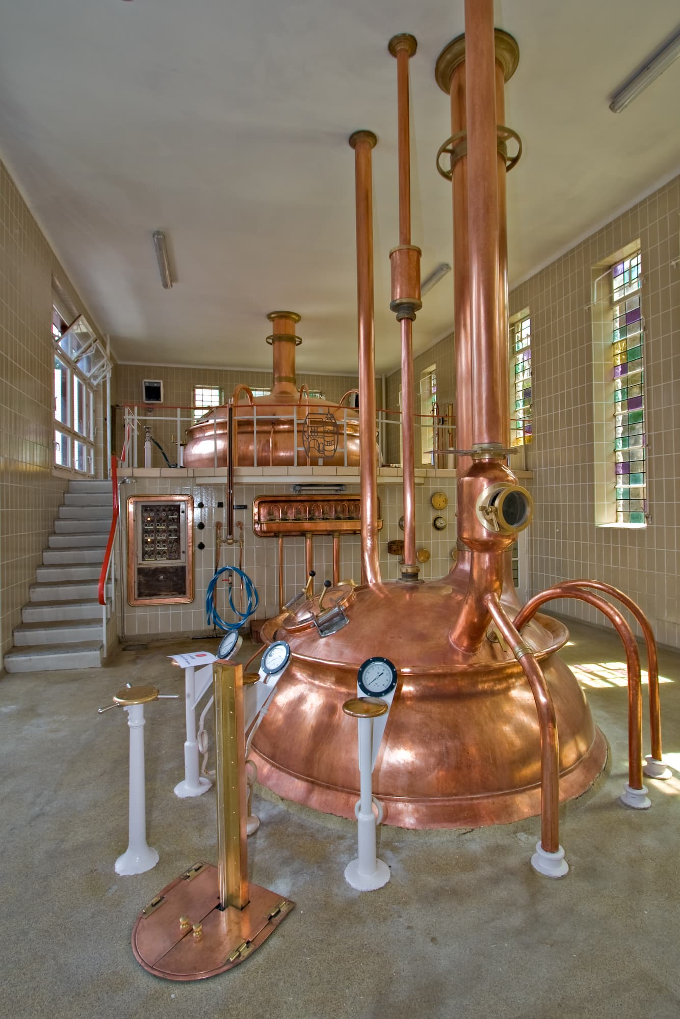 Copper-clad processing vessels and piping inside a brewery